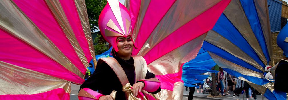 Pink winged performer at Leyton Carnival